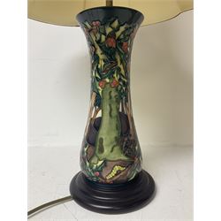 Moorcroft table lamp, of waisted form, decorated in the Holly Hatch pattern, on wooden plinth, with accompanying cream shade of lobed form, with piped detail, H33cm (excluding fitting)