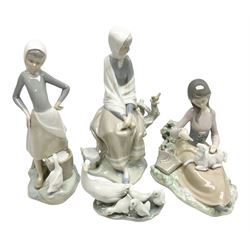 Four Lladro figures, comprising Feed Time no 1312, Young Shepherdess no 4576, Girl with Duck no 4682 and Little ducks with Mother no 4682, largest example H24cm 
