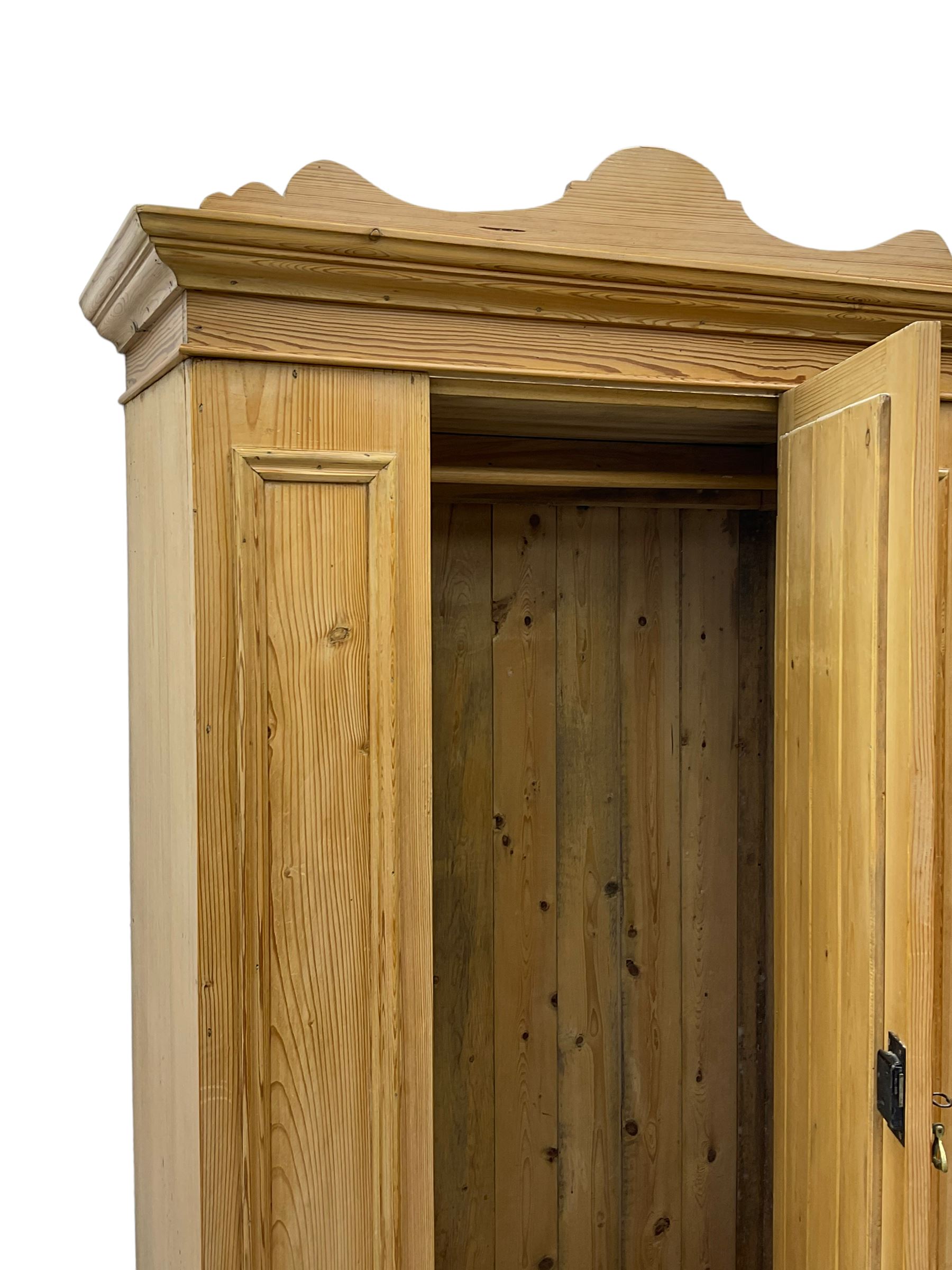 Edwardian pine single wardrobe, with mirror door and drawer to base