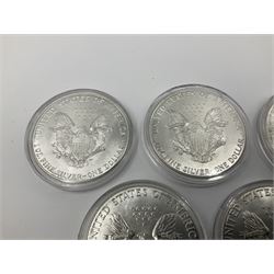Five United States of America 1oz fine silver one dollar coins, dated 1986, 1987, 1988, 1989 and 1990