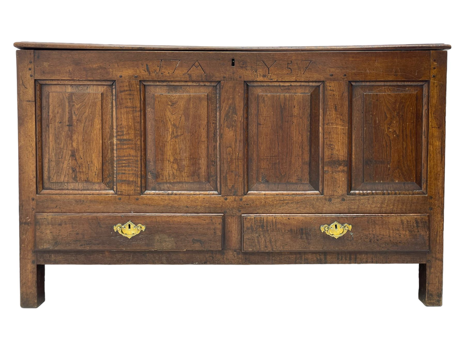 Georgian oak mule chest, moulded rectangular hinged lid over quadruple fielded panel front, the frieze inscribed '17 A Y 57', fitted with two drawers, panelled ends and back, on stile supports