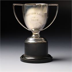 Victorian silver cup with embossed decoration on a plastic base, height of cup 16cm Birmingham 1868 and a small silver challenge cup 'Whitby Show 1950'