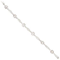Art Deco French platinum diamond bracelet, six pierced design navette shaped links, set wi...
