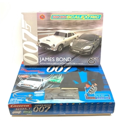 Carrera Go James Bond Die Another Day slot-car racing set No.60007; and MicroScalextric James Bond Aston Martin DB5 and DBS racing set, both boxed (2)