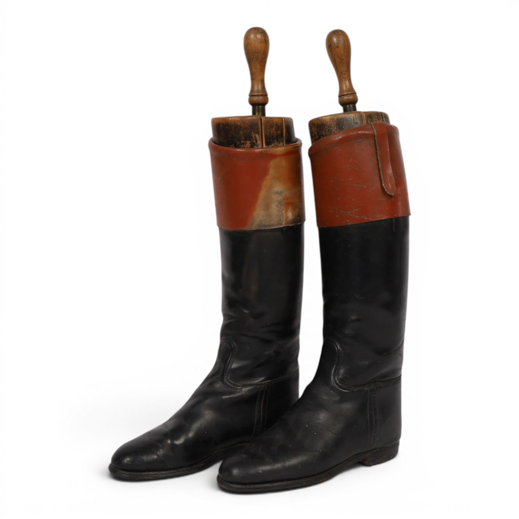 Pair of brown leather topped riding boots, with wooden shoe trees