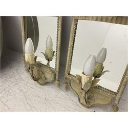 Pair of white brushed metal wall lights, with single branched arms supported on mirror backs, with tassel and foliage detail, H52cm