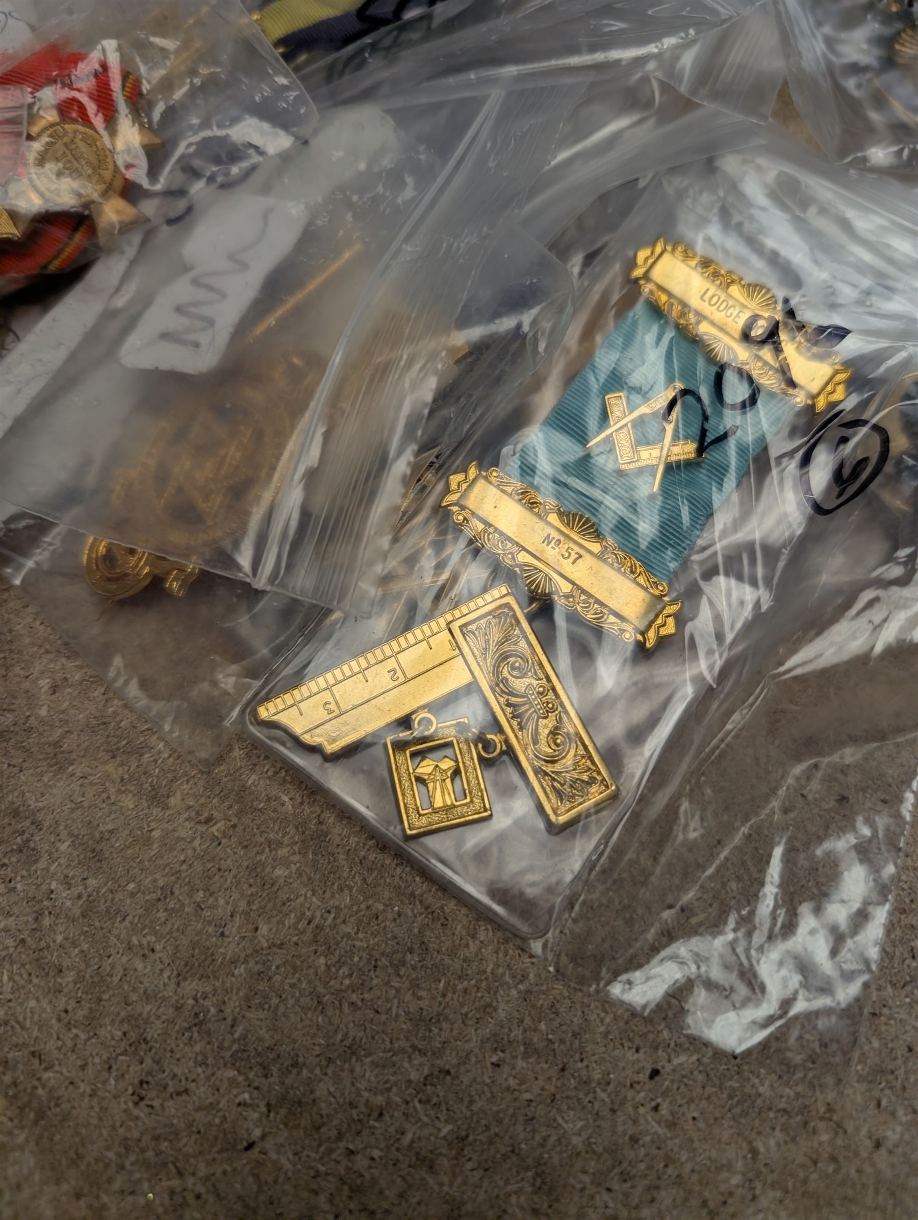 Collection of Masonic jewels, including silver example, together with military pin badges, two silver necklaces and other collectables