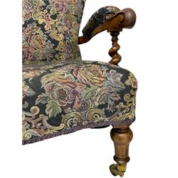 Victorian walnut framed open armchair, scrolled arm terminals over spiral turned arm supports, upholstered in foliate patterned fabric with sprung seat, on turned supports and brass castors (W65cm H92cm); and Victorian mahogany nursing chair with lobe carved supports (W60cm H92cm)