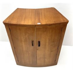 Mid 20th century teak cocktail bar, hinged top above two cupboard doors enclosing fitted interior, two sliding glazed doors to rear