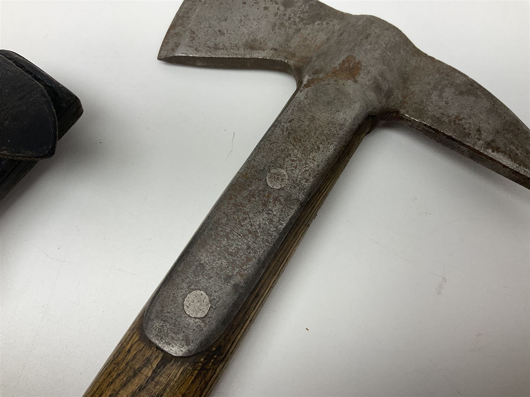 Post-War military type fireman's axe impressed 'PERKS 1953/54' with additional indistinct mark probably WD arrow, ash handle L39cm; and another stonemason's(?) double headed axe with mallet shaped shaft (2)