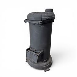 Late Victorian cast iron stove of small proportions, decorated with scrolls and central rosette to the top
