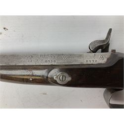 SECTION 1 FIREARMS CERTIFICATE REQUIRED OR REGISTERED FIREARMS DEALER - Pair of Reproduction Continental .44 calibre percussion target pistols, each with heavy 23.5cm octagonal to round barrel bearing various marks, crude scroll engraving to lock plate, hammer and octagonal section of barrel, unchequered walnut stock with brass butt plate and steel hooked trigger guard, numbered 8138 & 8164, L41.5cm overall; in maroon baize lined converted sapele mahogany fitted case bearing reproduction trade label for Trulock & Son Dublin containing small copper powder flask, steel scissor action bullet mould, nipple key, turned wooden mallet and lidded box, steel rammer and wooden cleaning rod, case L48cm