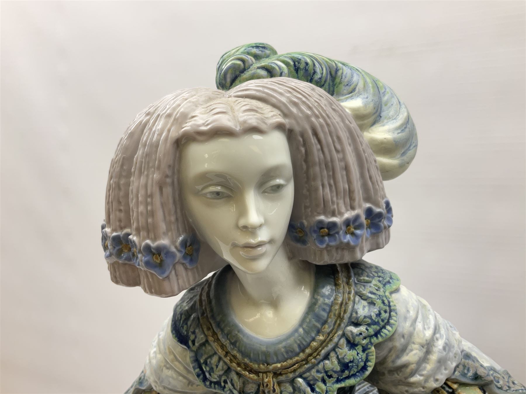 Large Lladro figure, La Menina, modelled as a maid of honor in service, on a mahogany oval base, limited edition 99/1000, sculpted by Jose Puche, with certificate of authenticity, framed and glazed, no 1812, year issued 1996, year retired 2019, H60cm