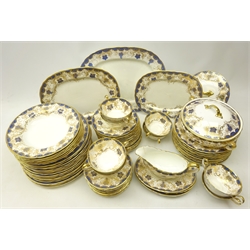  Aynsley part dinner service decorated with a grape and vine border, comprising set of three graduating platters, fifteen dinner plates, ten side plates, six shallow bowls, eight twin handled soup bowls, gravy boat, tureen,  tea plates and twelve saucers etc   