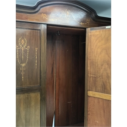 Edwardian mahogany wardrobe, arched pediment and panels inlaid with trailing husks and foliage, central bevelled edge mirror door, two drawers to base, on bracket feet, W154cm, H219cm, D50cm