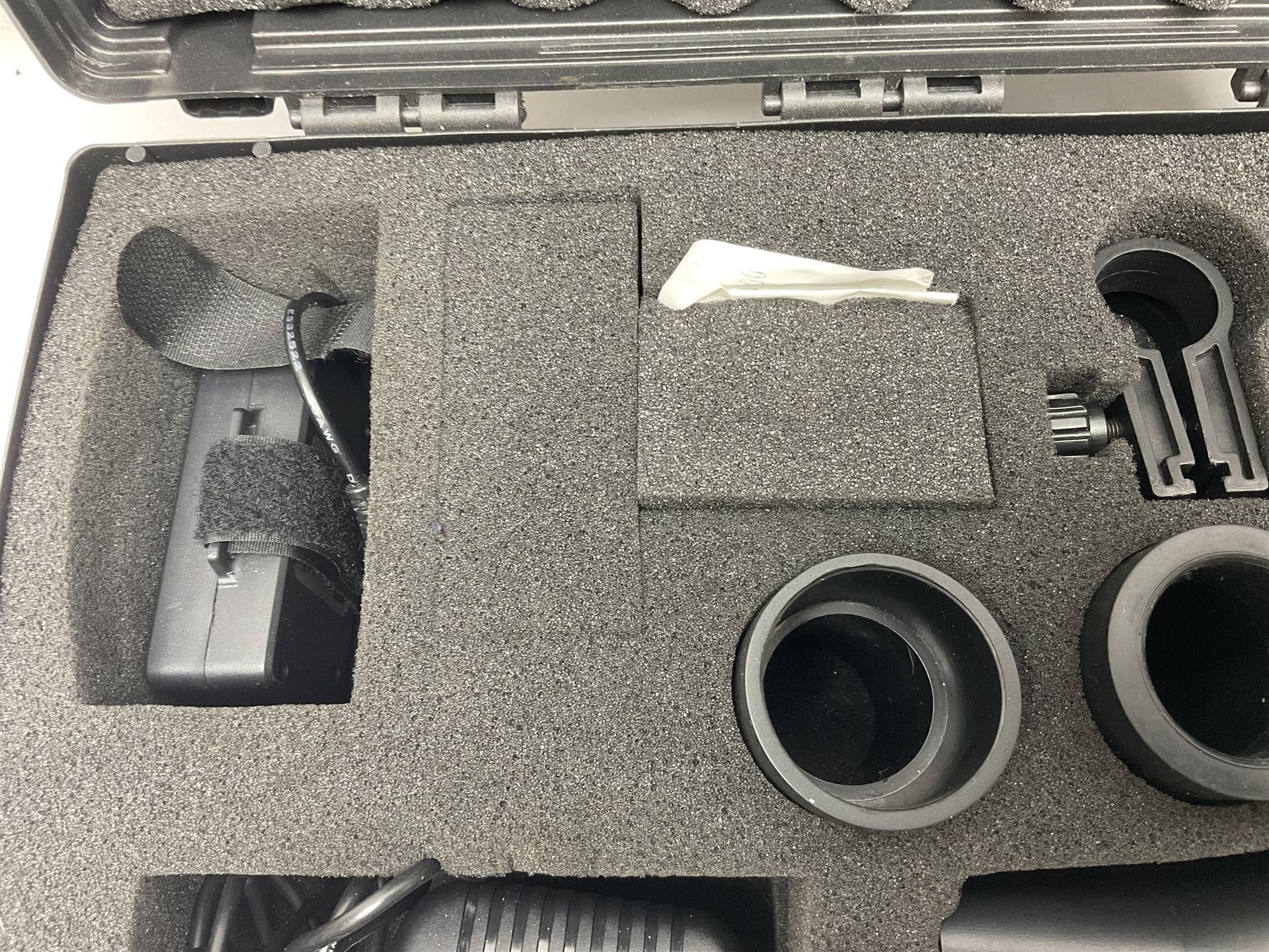 Two Nite-Site add-on kits in hard plastic carrying cases; one with charger