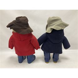 Pair of Paddington Bear teddies with amber eyes, the first example having a brown felt hat, red coat and blue PB boots with original label; the second having a grey felt hat, blue coat and blue Dunlop boots, tallest H51cm 