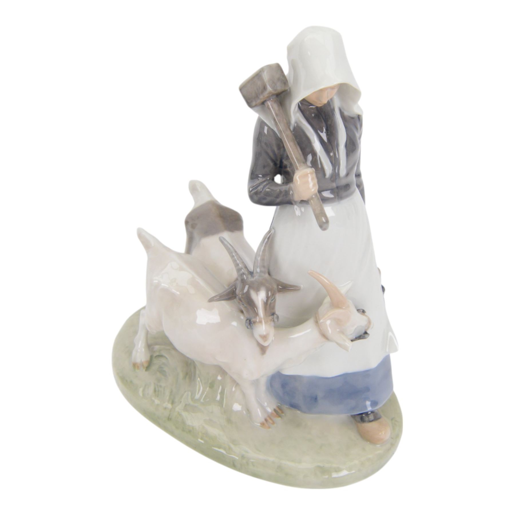 Five Royal Copenhagen porcelain figures of farm animals, comprising Boy with Pig no 848, Boy with Calf no.772, Boy with Sheep no 627, Boy with Calf's no.1858, Girl with Goats no 694