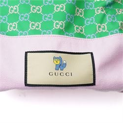 Gucci x Palace skateboard, Spring/Summer 2021, green GG monogram wood deck with multicolour ‘AH AH AH! GUCCI’ lettering and cartoon character mascot motif, fitted with Gucci-branded metal trucks and red and cream wheels, model no. 689103 JCGMN, presented with original GG monogram drawstring dust bag, protective sleeve, outer box and accompanying cards, Skateboard L81cm W20cm