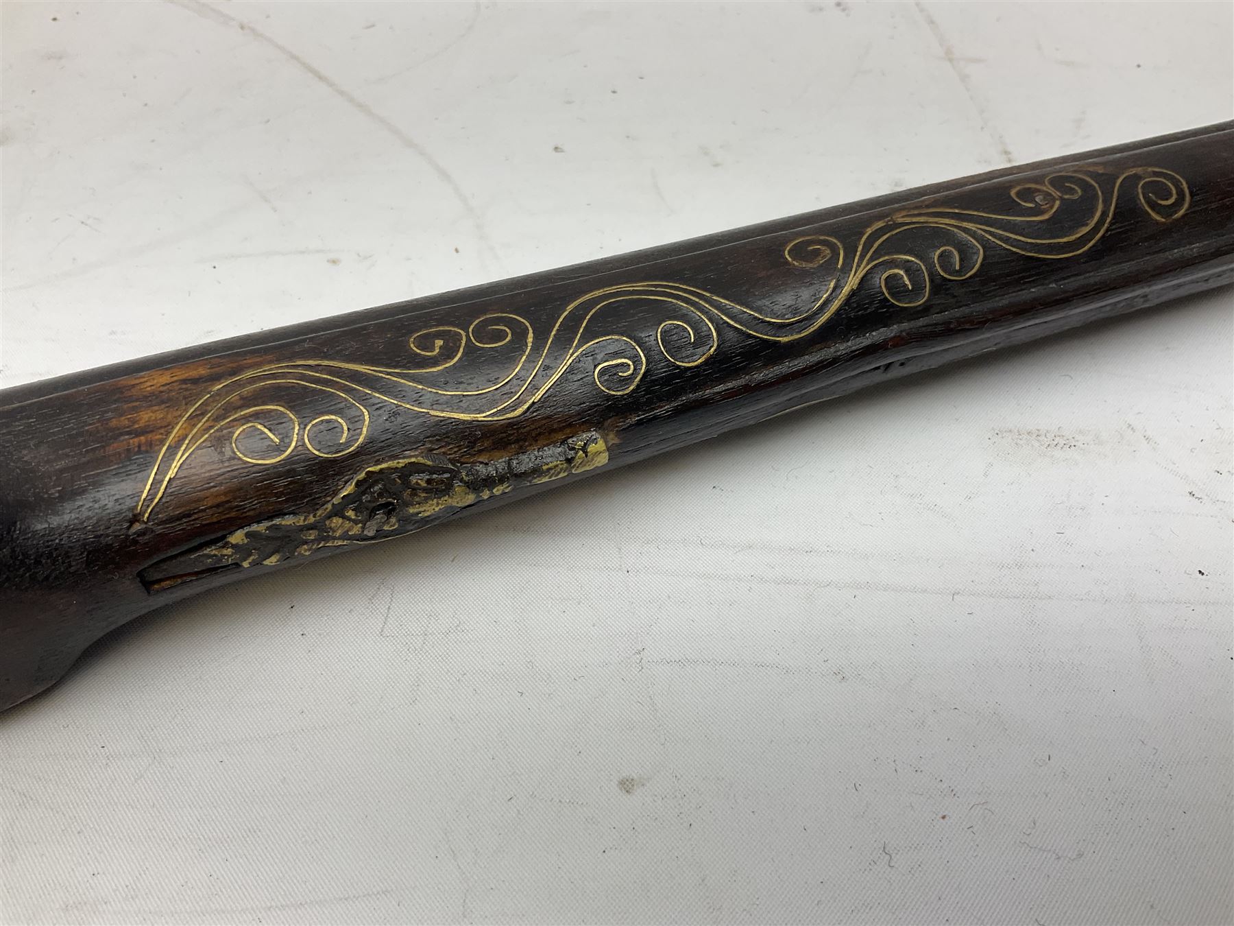 REGISTERED FIREARMS DEALERS ONLY - Reproduction flintlock pistol, the full walnut stock with brass filigree inlay and mounts and skull crusher butt L46cm; no visible proof marks - Disposed 25.06.25 - Notified 24.07.25