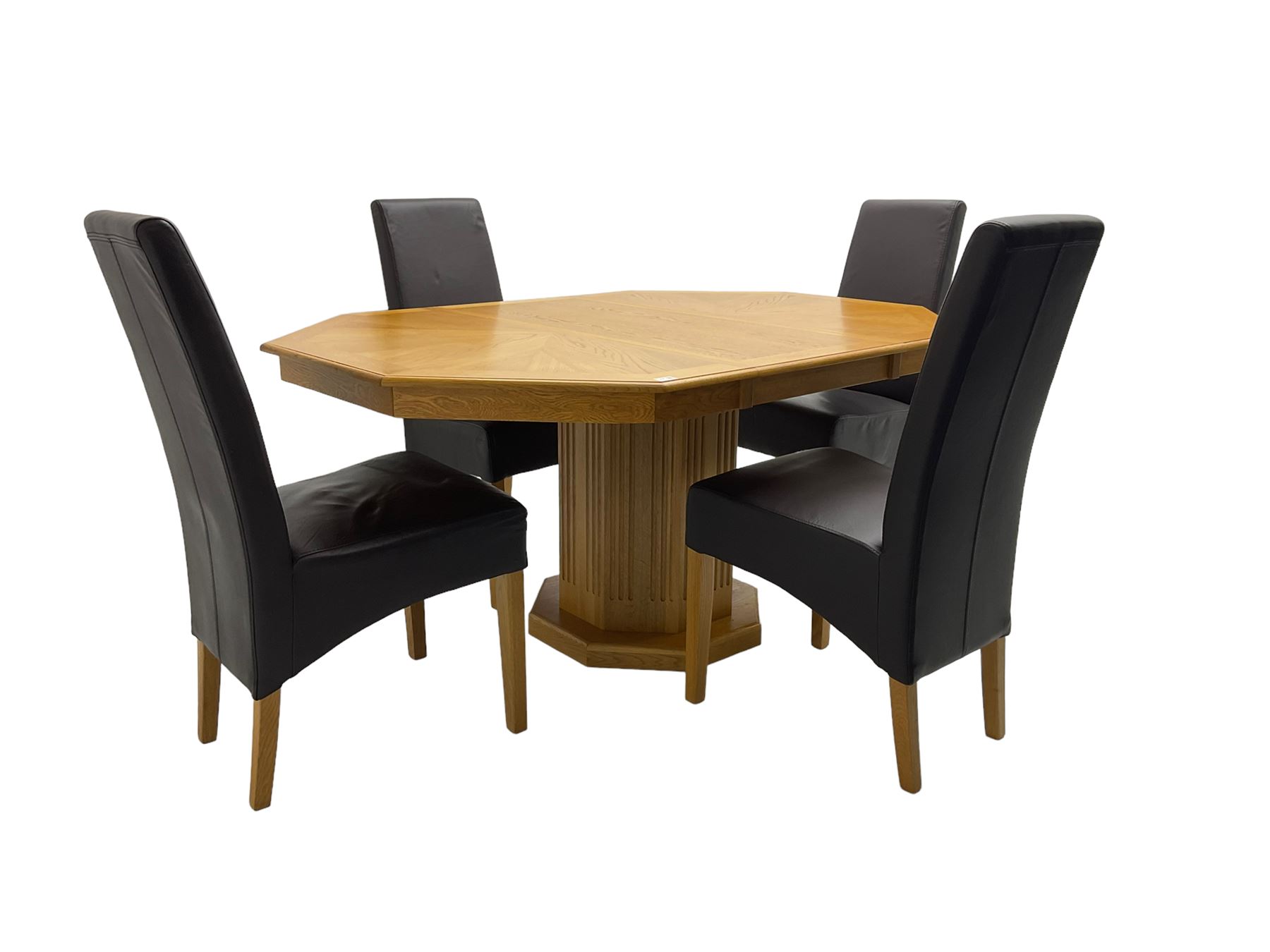 Oak octagonal extending dining table with additional leaf, octagonal pedestal base with fluting (150cm x 105cm x 76cm), and set four high back dining chairs upholstered in chocolate brown faux leather on square tapering supports (47cm x 54cm x 102cm)