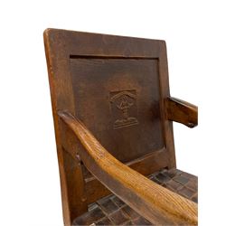 Mouseman - circa. 1930s set of six (4+2) oak dining chairs, panelled back carved with the Bagshawe family crest, the moto 'Forma Flos Fama Flatus' over an arm grasping a bugle-horn with ribbon tie and Yorkshire rose motif, adzed frame, leather lattice strap seat, on octagonal supports united by stretchers, two carvers and four side chairs, each carved with mouse signature, by Robert Thompson of Kilburn 

Provenance: Owned since manufacture by the Bagshawe family, descendants of the Staithes Group Artist Joseph Richard Bagshawe RBA (1870-1909).