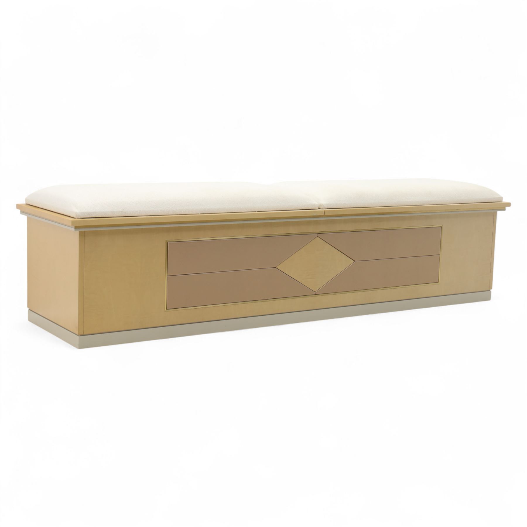 Contemporary maple veneered blanket box, twin upholstered lift-up lids revealing lined storage compartment, geometric panelled front on plinth base
