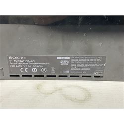 Sony PlayStation 3 60GB console with one PS3 controller, two PS2 controllers, BD remote control, PSP handheld gaming console with case, GAMEware PSP essentials pack, and a selection of PS2, PS3 and PSP games in original cases with instruction booklets 