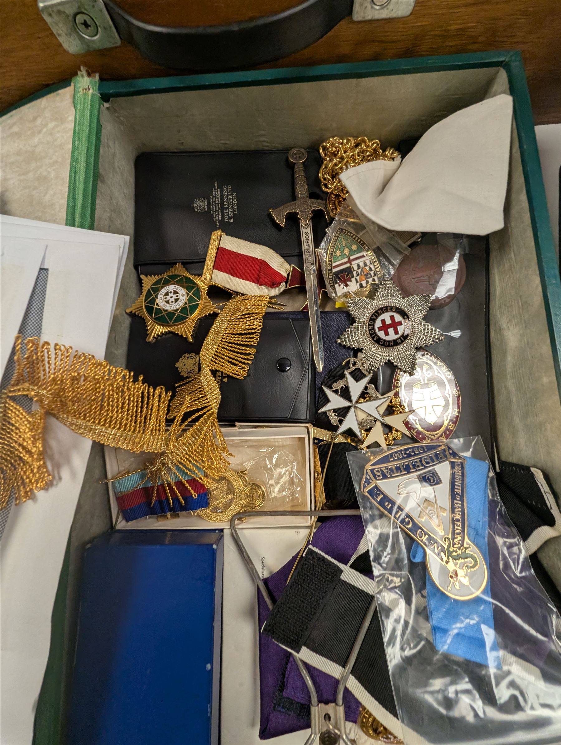 Collection of Masonic jewels and regalia, including robes, sashes, gloves, medallions, etc, in a number of briefcases and boxes