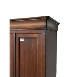 Cherrywood double wardrobe, two panelled doors enclosing hanging rail and two drawers, shaped plinth on bracket feet