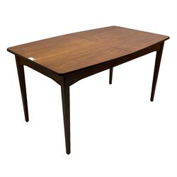 Mid-20th century teak dining table, extending rectangular top with fold-out leaf, on tapering supports