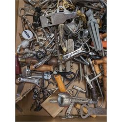 Collection of cork screws, bottle openers and bottle pourers, including turned wooden examples