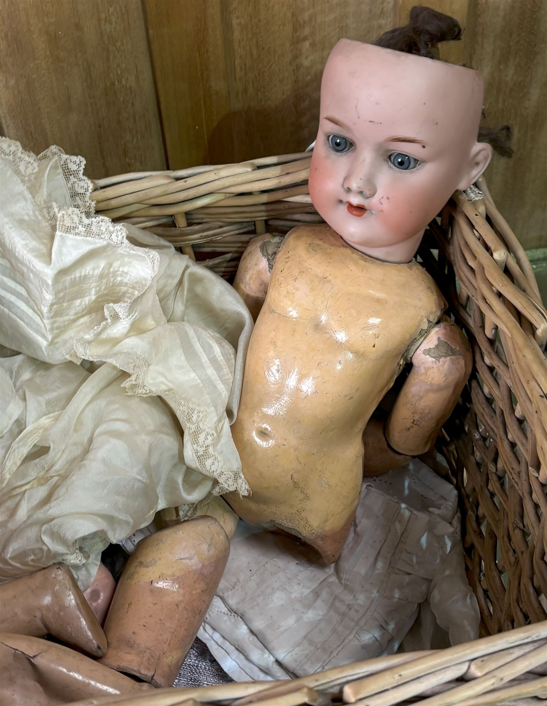 19th century bisque head doll, two other articulated dolls, together with a quantity of Victorian dolls clothes.  - COLLECTION BY APPOINTMENT FROM: The White House, Thirsk Road, Easingwold, York, YO61 3NF - CALL 01723 507111 TO ARRANGE