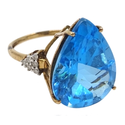 9ct gold pear shaped blue topaz ring, with diamond set shoulders, hallmarked