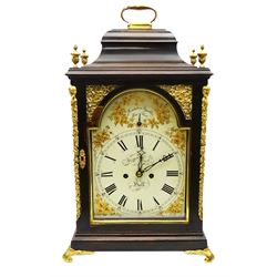 A late 18th century ebonised bracket clock retailed by William Rust, Market Place Hull c1790, case with brass handle and finials to an inverted bell top, pierced sound frets to the sides on foliate cast feet, break arch painted dial with Roman numerals, five minute Arabic's and minute track, matching steel hands and pendulum regulation to the arch, with painted depictions of gilded yellow flowers to the spandrels and conforming decoration to the arch, 8-day twin fusee movement with a recoil anchor escapement, striking the hours on a cast bell with pull repeat, movement backplate engraved “W Rust, Hull”. With pendulum. 
***William Rust 1780-1827, is recorded as a clockmaker and goldsmith. Partnered with John Shipham as Rust & Shipham 1820s, later becoming Barnby & Rust. 
