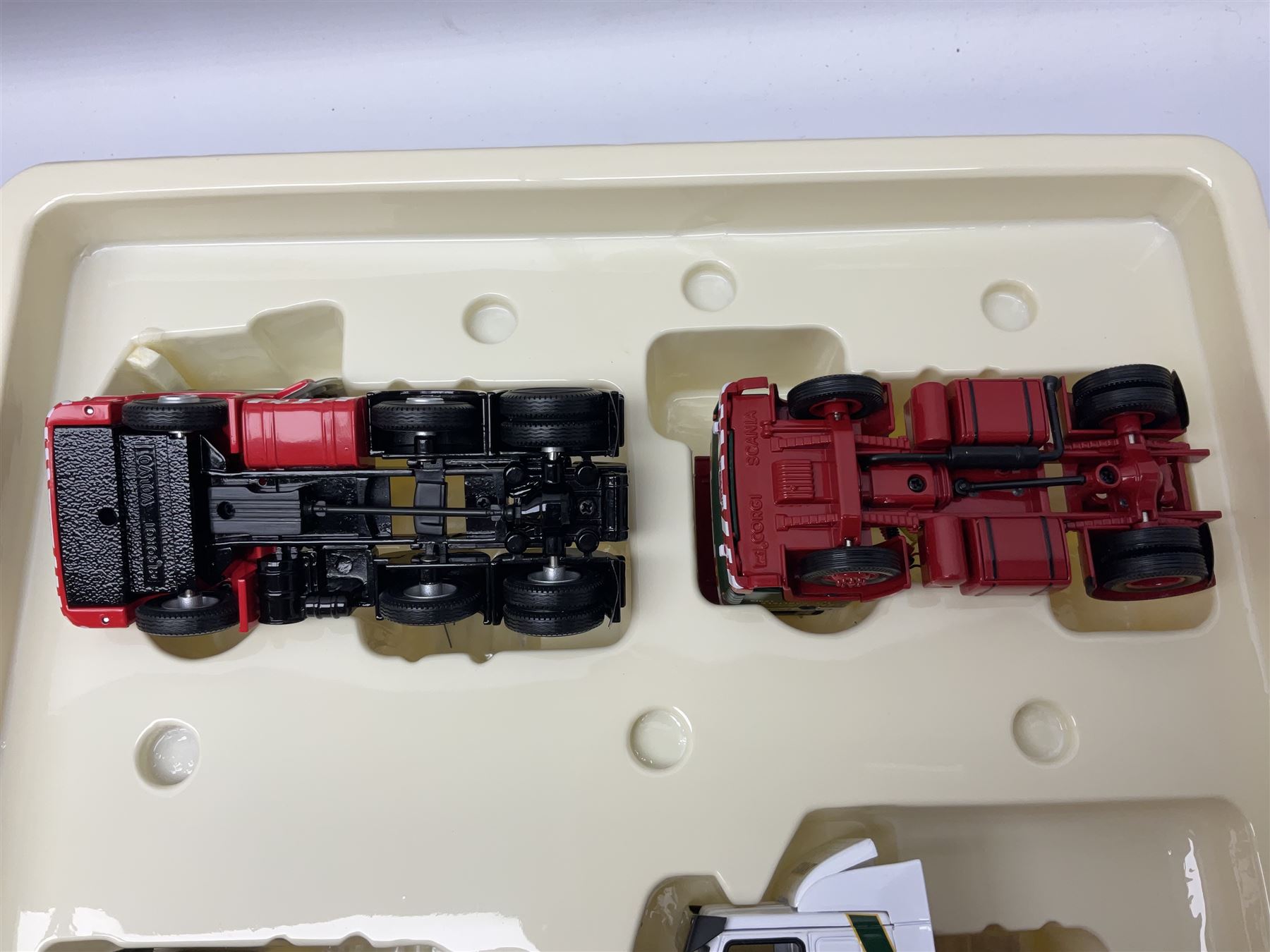 Corgi Eddie Stobart - two limited edition Hauliers of Renown sets; CC99203 Edward Stobart 1954-2011 Commemorative Set; and CC99202 1970-2010 40th Anniversary Set; both boxed (2)