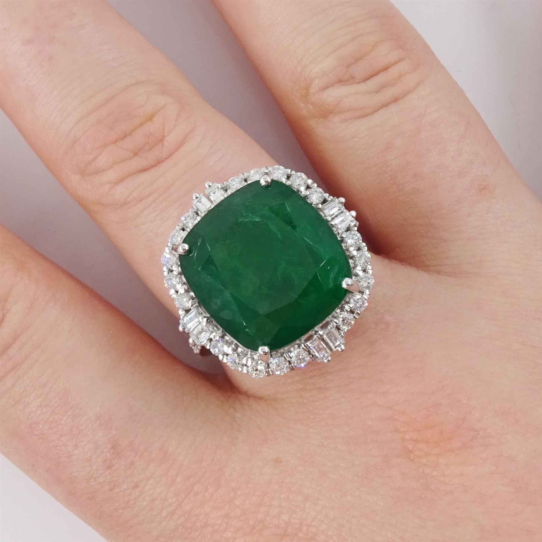 18ct white gold emerald and diamond cluster ring, single cushion cut emerald of approx 13.20 carat, with round brilliant cut and baguette cut diamond surround and shoulders, stamped, total diamond weight approx 0.80 carat