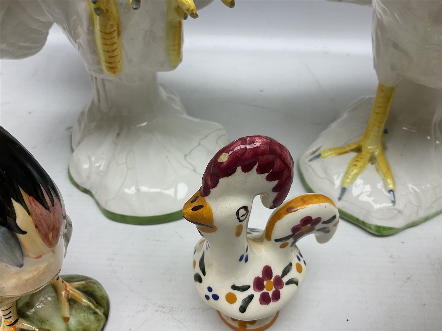 Pair of fighting cockerels from Italy together with three other ceramic cockerels, largest H30cm 