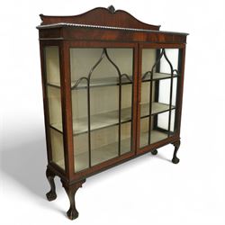 Early 20th century mahogany display cabinet, shaped pediment over a dentil moulded cornice...
