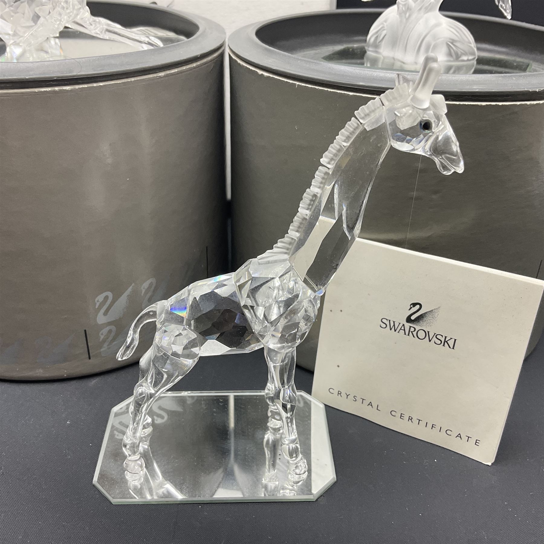 Five Swarovski Crystal figures, comprising giraffe, deer, hummingbird, rose and rearing horse, all with original boxes 