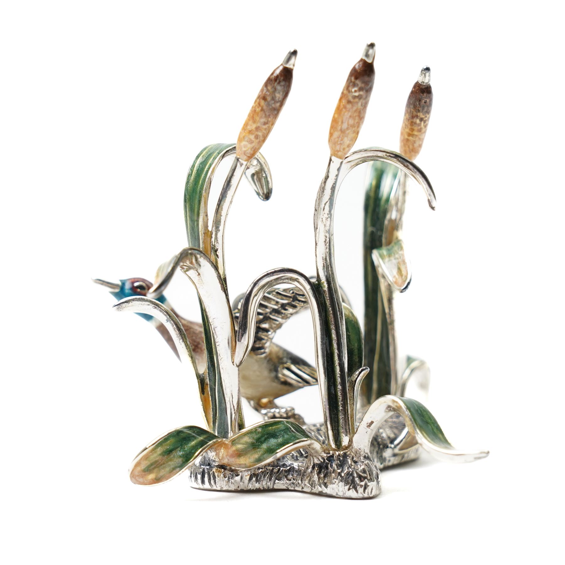Silver and enamel model of a mallard taking flight from bulrushes and on a naturalistic base  H7cm x W7cm marked 925