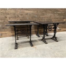 Four cast iron pub or bar tables with rectangular tops