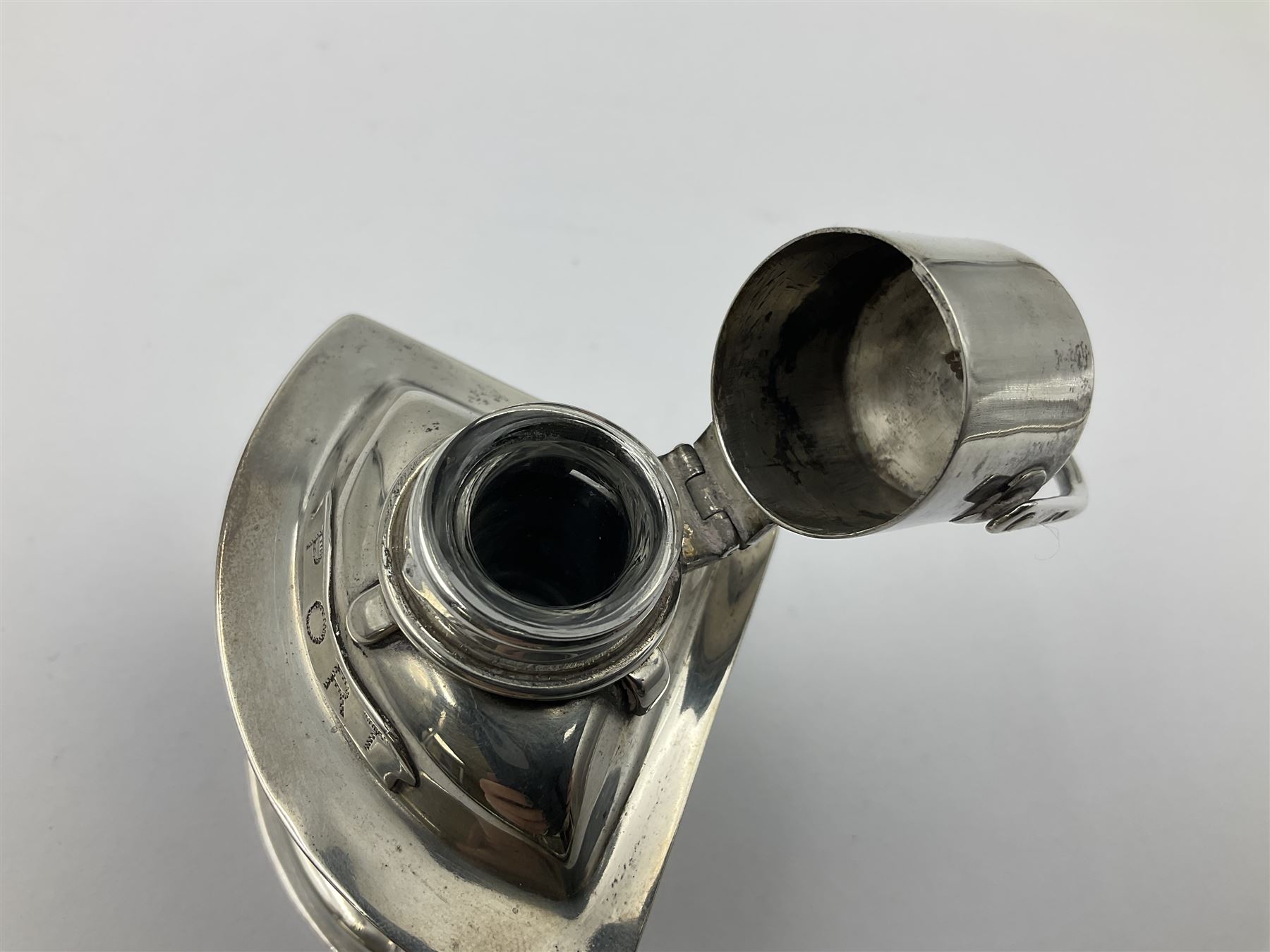 Early 20th century silver novelty inkwell, modelled as a ship's port lantern, with swing handle, convex red glass panel and hinged cover opening to reveal a glass liner, hallmarked Samuel Jacob, London 1911, height not including handle H8.5cm