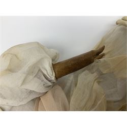 Victorian wax shoulder head doll with pale complexion, applied hair, inset glass eyes and fabric covered jointed body with kid leather lower arms; white linen dress and undergarments H50cm