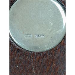 Two silver mounted bottle coasters, the larger example with latticework sides, hallmarked Mappin & Webb Ltd, Birmingham 1993, the smaller example with pierced sides, hallmarked W I Broadway & Co, Birmingham 1998, largest D12cm