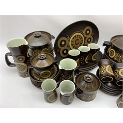 Denby Arabesque patter tea and dinner wares, comprising six dinner plates, twelve side plates, six twin handled bowls and covers, two tureen and covers, four oval serving platters, coffee pot, water jug, milk jug, cream jug, sucrier and cover, and eight coffee cans. 
