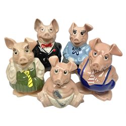Set of five Wade NatWest money boxes, comprising father, mother, boy, girl and baby