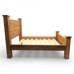 Alexander Ellis of Beverley - rustic pine king sized bed, of plank form construction with visible dowels, raised on stile supports