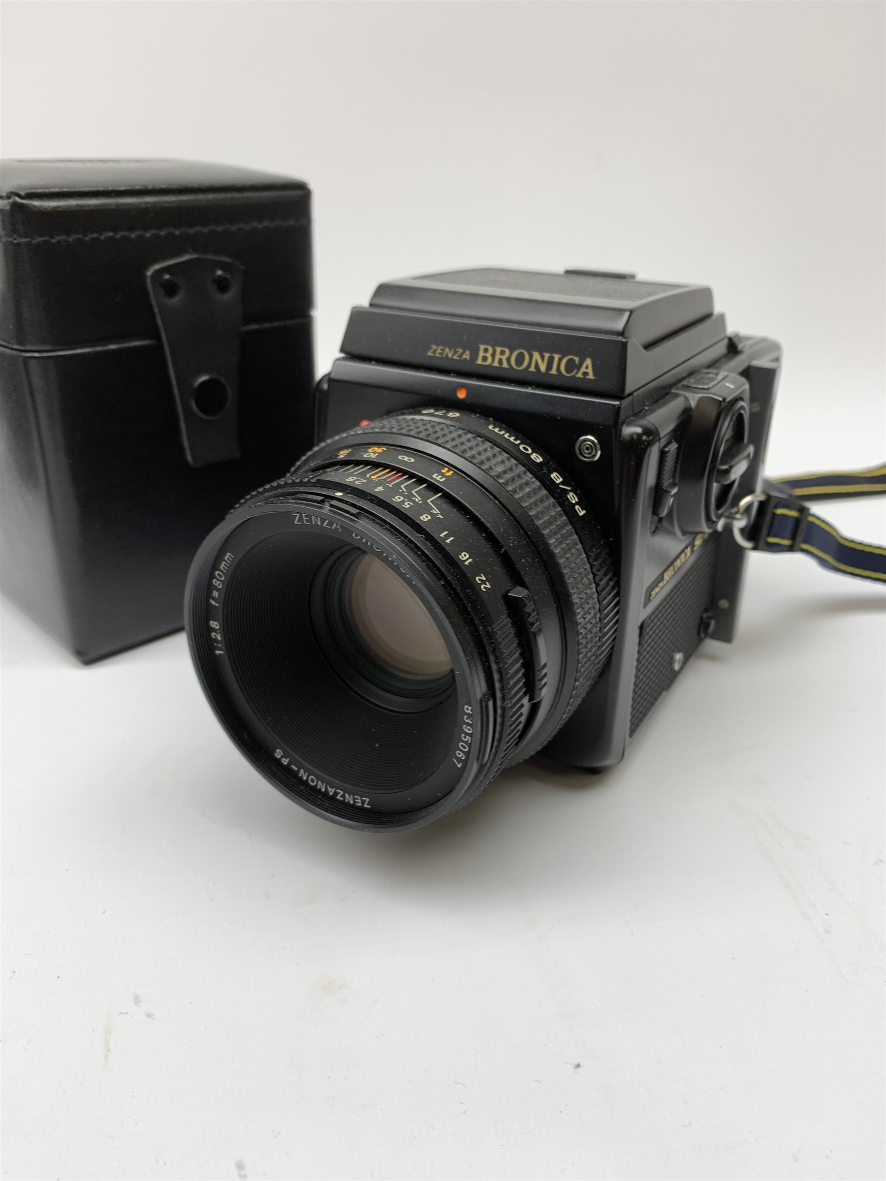 'Zenza Bronica SQ-B' camera fitted with 'Zenza Bronica Zenzanon-PS 1:28 f=80mm' lens, 'Zenza Bronica Zenzanon-PS 1:4 f=150mm' lens and 'Zenza Bronica Zenzanon-S 1:35 f=50mm' lens, with an instruction booklet