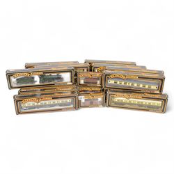 Two Mainline Railways '00' gauge locomotives, including 37090 Mogul Locomotive GRW green, together with five Mainline Railways '00' gauge goods wagons and fourteen coaches, including Cornish Riviera Examples, all boxed 